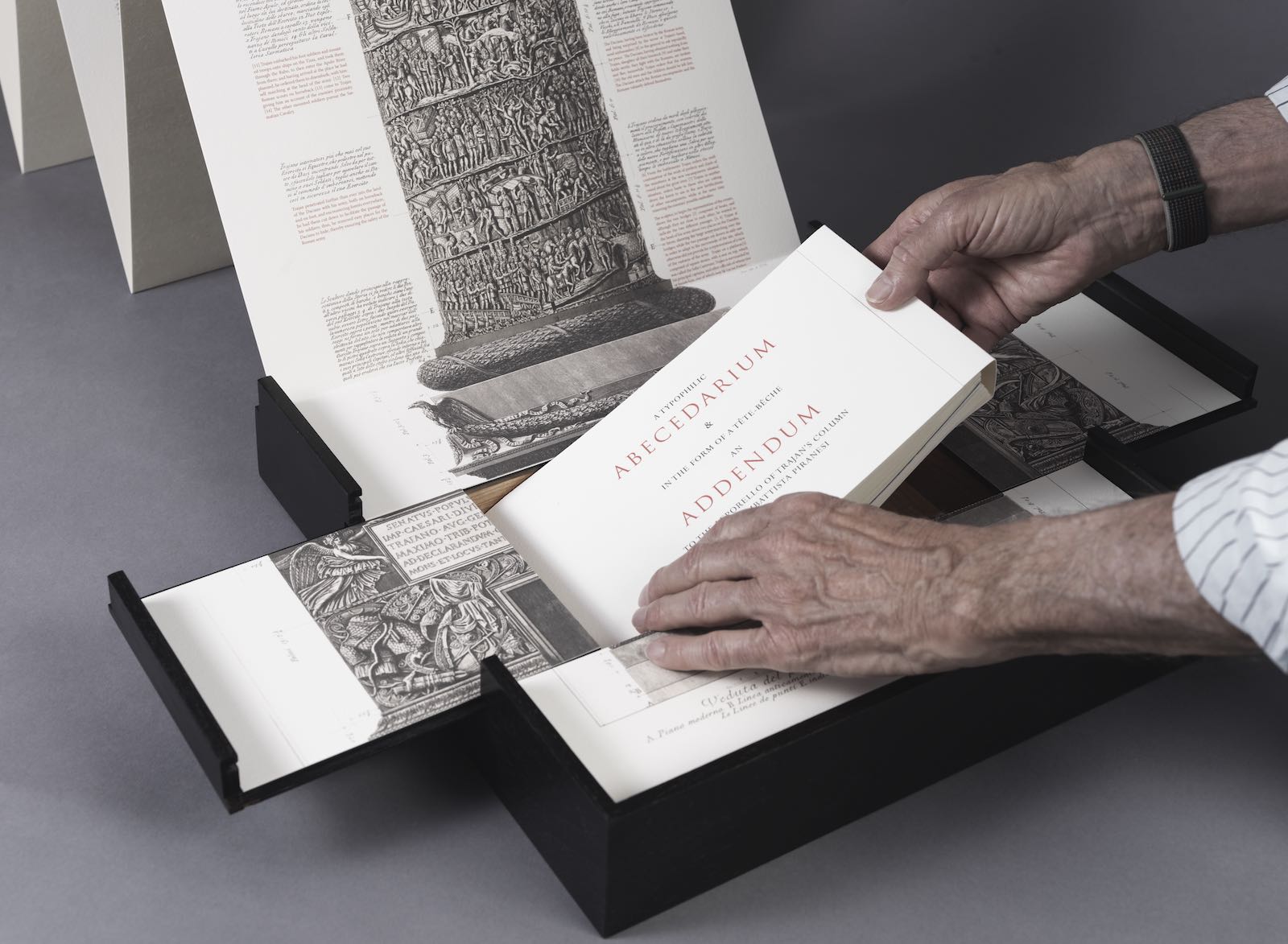 Abecedarian being removed from the base of TRAIANUS by Rutherford Witthus