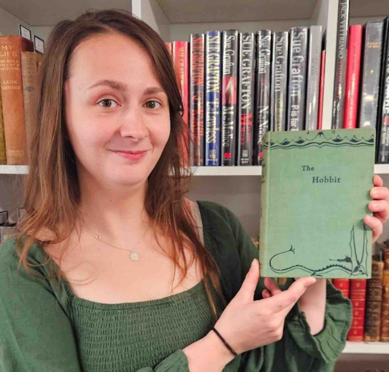 Auctioneum book specialist Caitlin Riley with the copy of The Hobbit